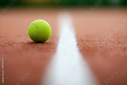 Sports. Close Up Shot Of Tennis Ball On Court. © puhhha
