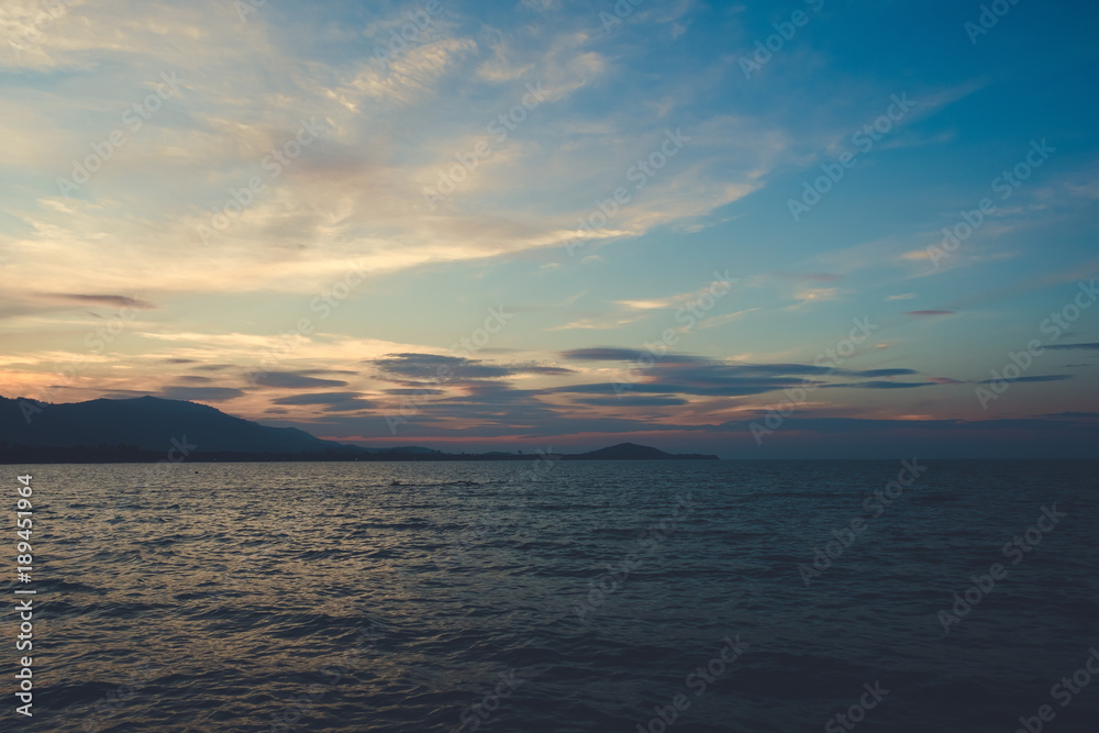 Image of sea or ocean and mountain with beautiful background before sunset in the evening time Image of sea or ocean and mountain with beautiful background before sunset in the evening time