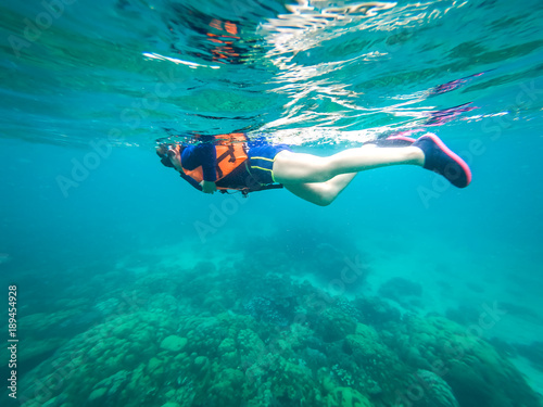 Beautiful women are diving snorkeling in the sea.