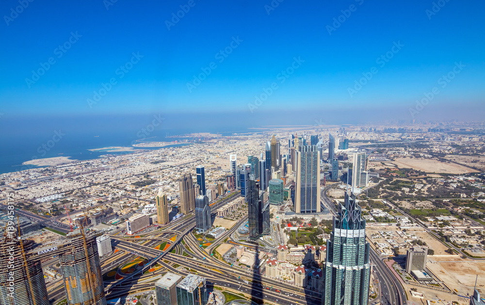 Fototapeta premium Skyscrapers on Sheikh Zayed Road in Dubai, UAE. View of Downtown Dubai from the observation desk of Burj Khalifa.