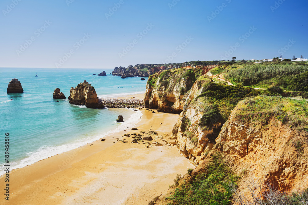 Beautiful sandy beach near Lagos in Ponta da Piedade, Algarve region, Portugal Beautiful sandy beach near Lagos in Ponta da Piedade, Algarve region, Portugal