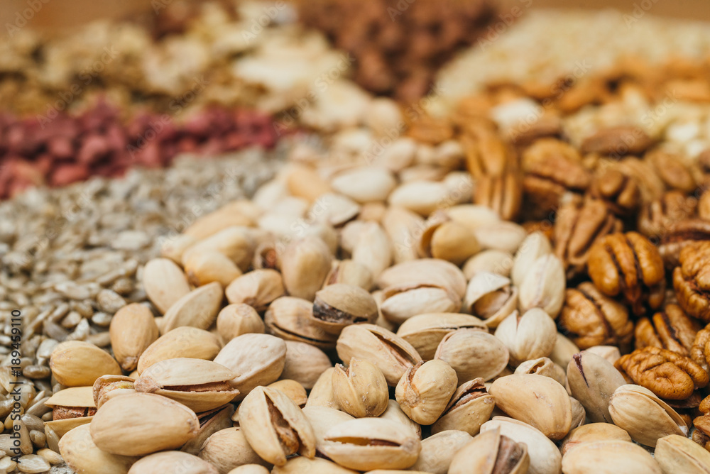 Nuts mix in a canvas bag in table. Ten kinds of nuts: pecan, brazil, cedar, sunflower, hazelnut, almond, peanut, walnut, pistachio, cashew. Nuts mix in a canvas bag in table. Ten kinds of nuts: pecan, brazil, cedar, sunflower, hazelnut, almond, peanut, walnut, pistachio, cashew.