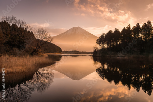 Mountain Fuji and Lake Tanumi with beautiful sunrise in winter season. Lake Tanuki is a lake near Mount Fuji, Japan.