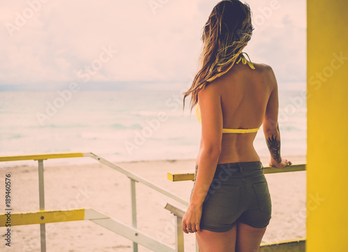 Beautiful woman in bikini at the lifeguard station, Miami, USA © Nejron Photo