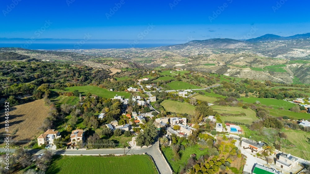 Aerial bird's eye view of traditional village Kato Akourdalia, Paphos, Cyprus. The mountains, valley, trees, nature, Latchi - Akamas beach and agritourism resorts and villas in Pafos from above.