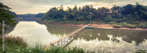 Beautiful view of a bamboo bridge. Laos landscape. Panorama photo