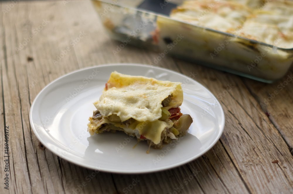 Homemade vegetarian lasagna on the wooden table