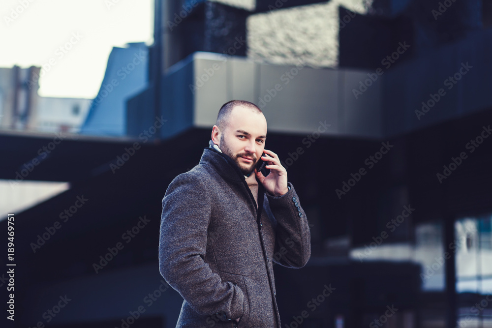 successful business man speaks by phone successful business man speaks by phone