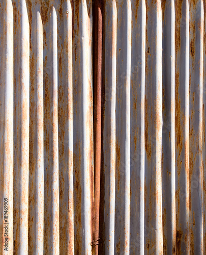 Rusty metal fence as a background