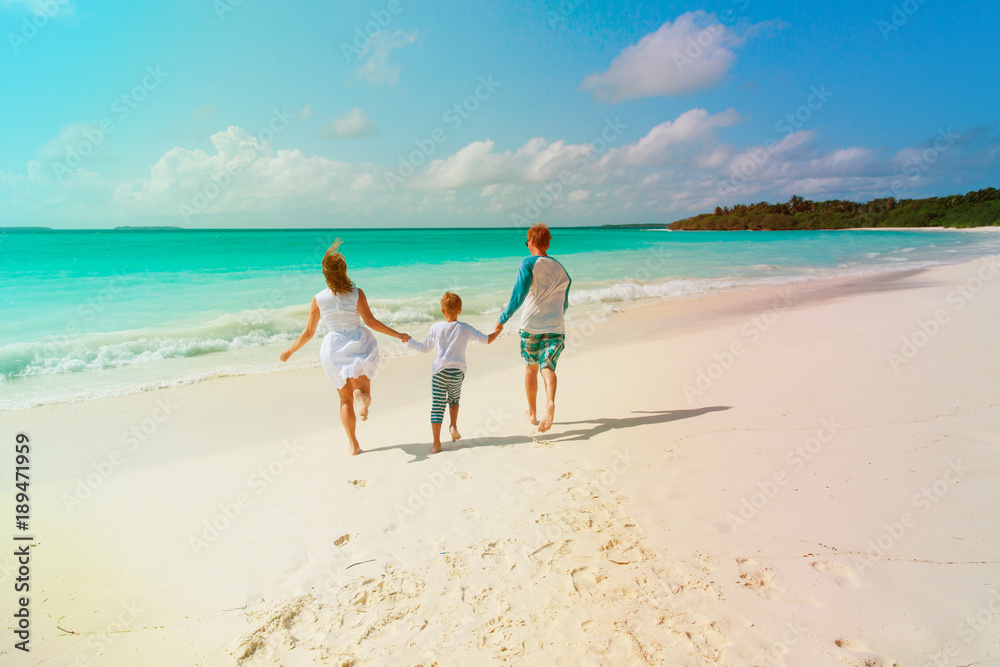 happy family with kid play run on beach