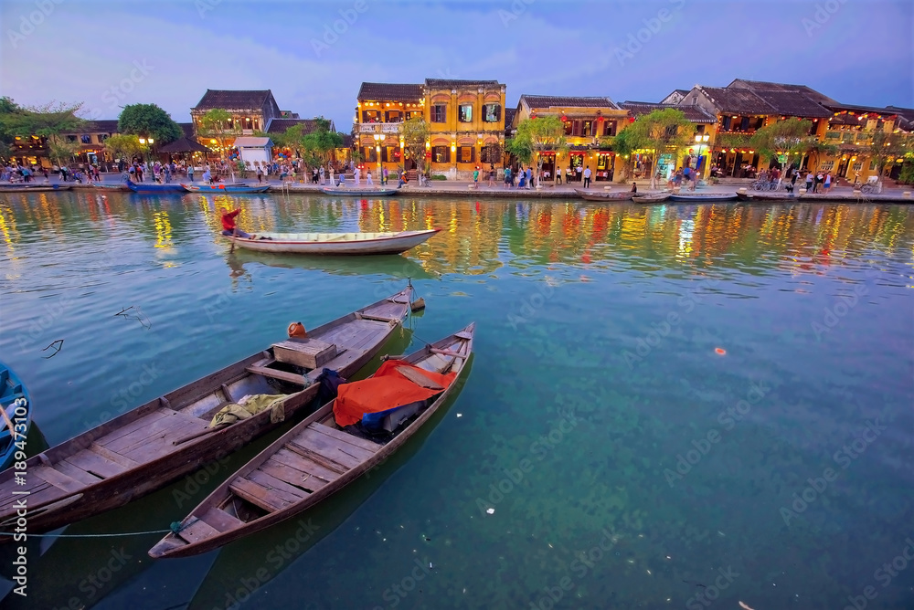 The Ancient city of Hoi An on the Thu Bon River, Vietnam, at dusk.