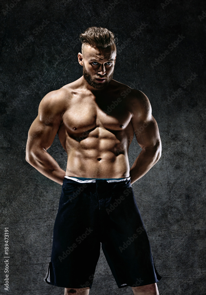 Sporty muscular man shirtless. Photo of man with perfect body after training. Strength and motivation