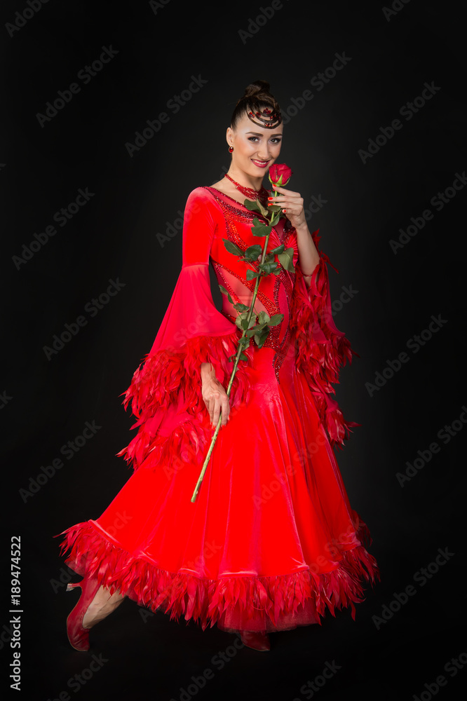 Sensual woman smile with rose flower on dark background Sensual woman smile with rose flower on dark background