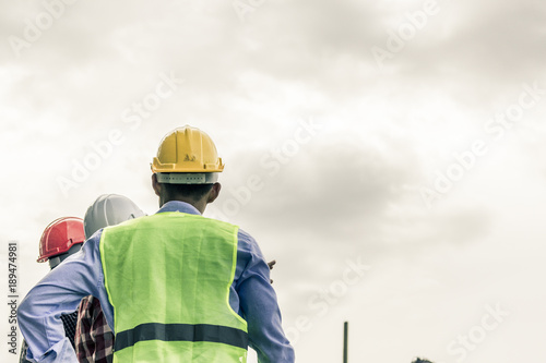 Engineer pointing orders for worker team to work safety