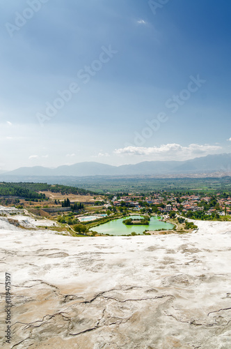 Sonny view of natural travertine pools and terraces in Pamukkale, Denizli province, Turkey.