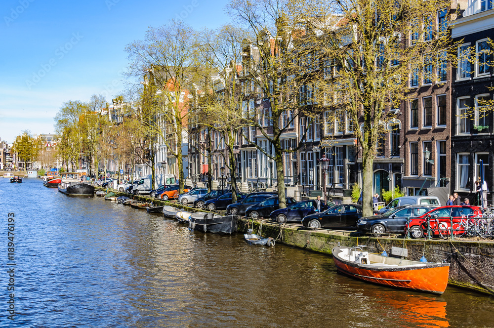 Boats and boathouses in Canals of Amsterdam, Holland