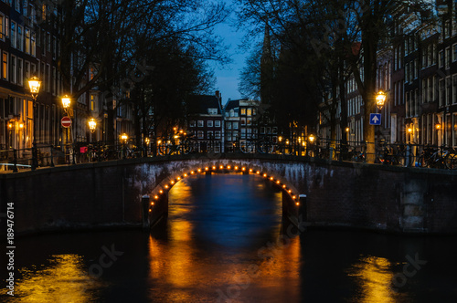 Bridges at night in Canals of Amsterdam, Holland