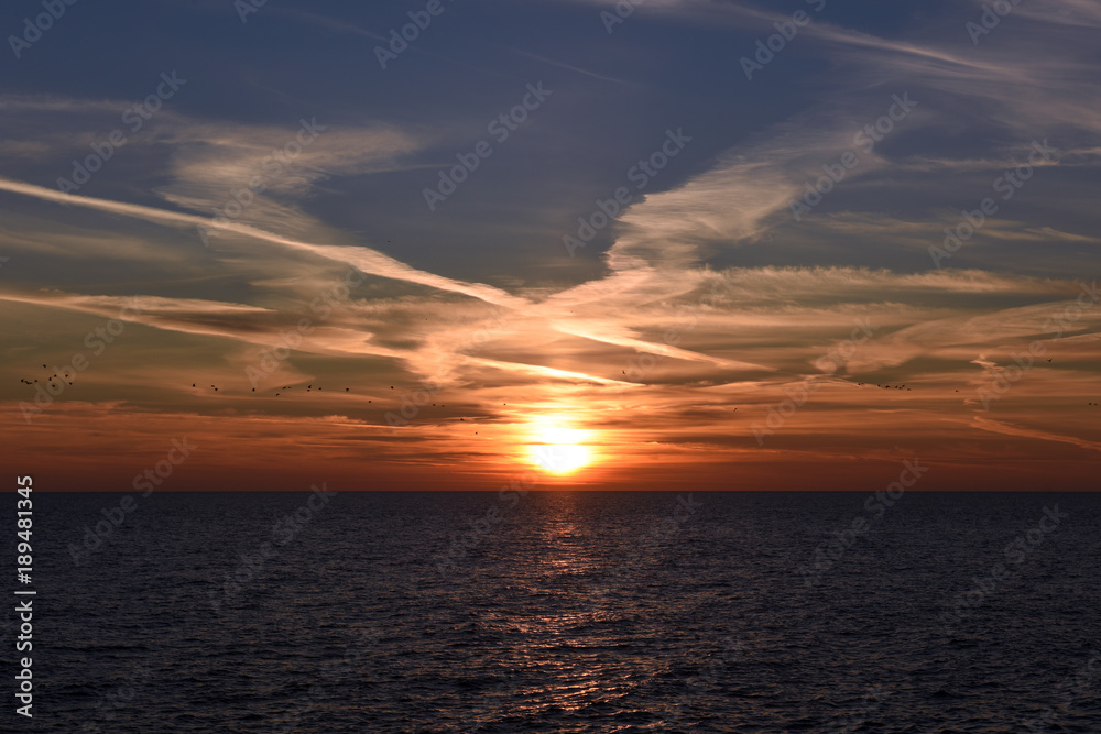 Scenic clouds over the sea at sunset