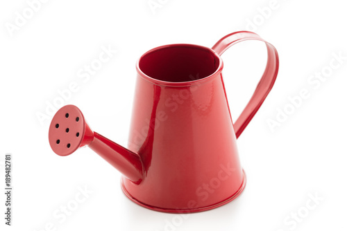 Red watering can on isolated on a white background