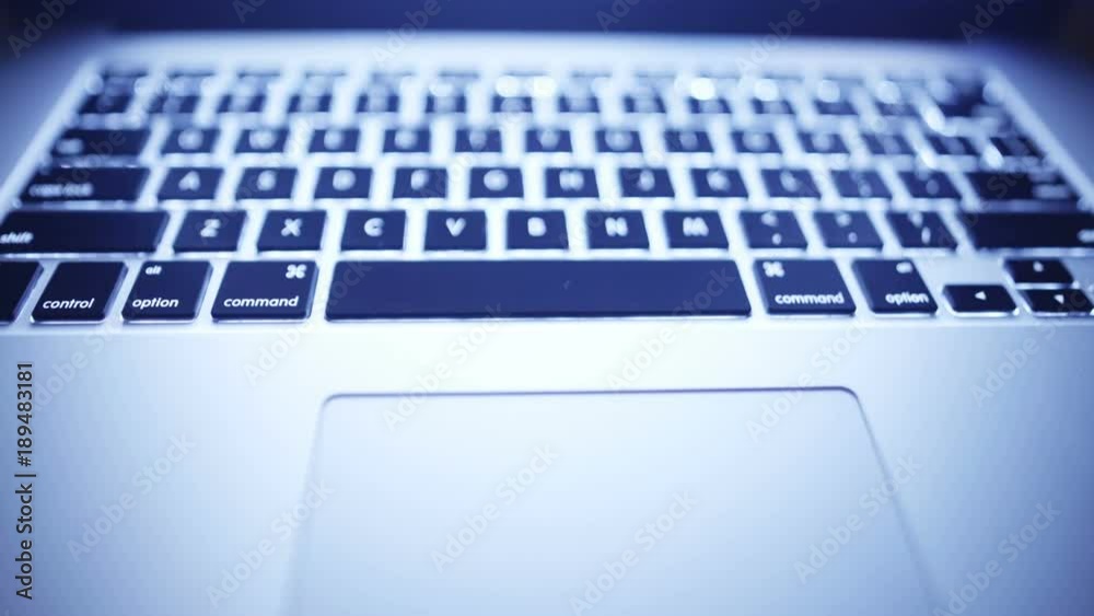 Sliding video of laptop keyboard, touchpad on foreground Sliding video of laptop keyboard, touchpad on foreground