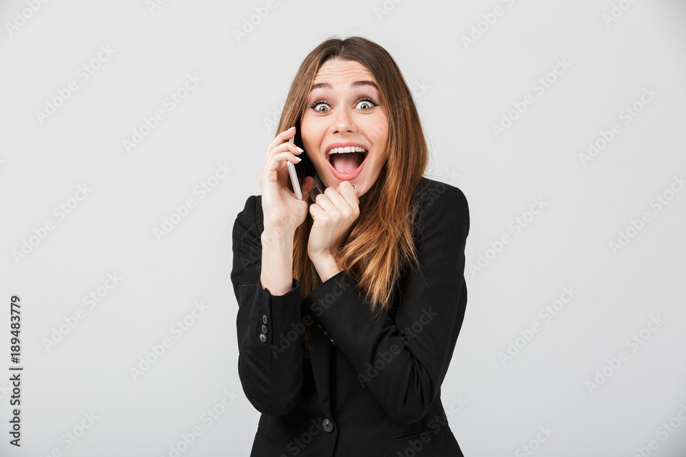 Happy woman talking on smartphone and smiling isolated Happy woman talking on smartphone and smiling isolated