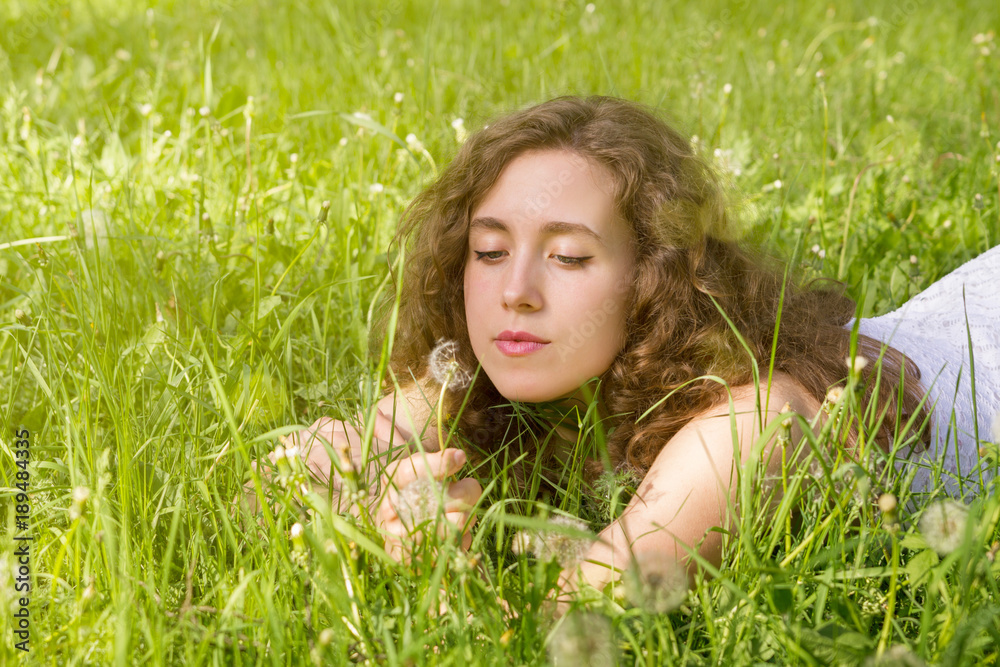 Woman having rest on meadow Woman having rest on meadow