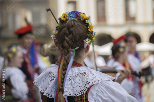 Rear view of a polish woman of a folk dance group with traditional costume