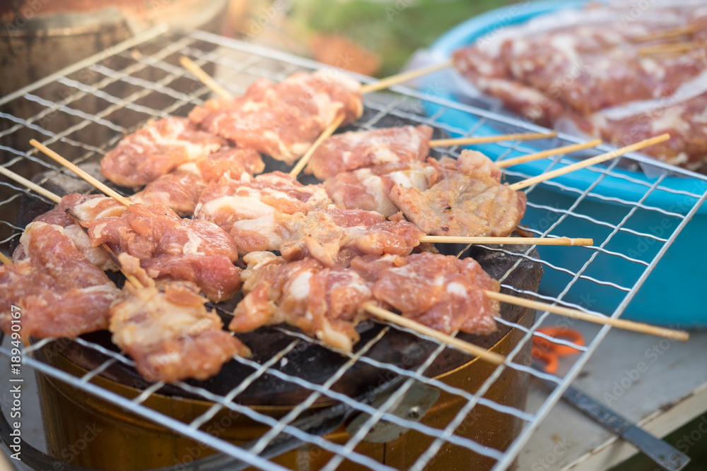 Thai style pork barbecue on grill