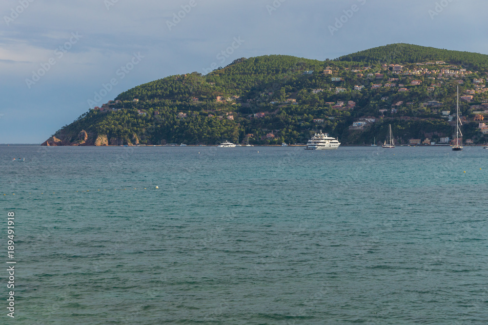 Panoramic view on the yachts in the harbour of the Theoule sur Mer located on the waterfront seen from Mandelieu-la-Napoule, France, Europe