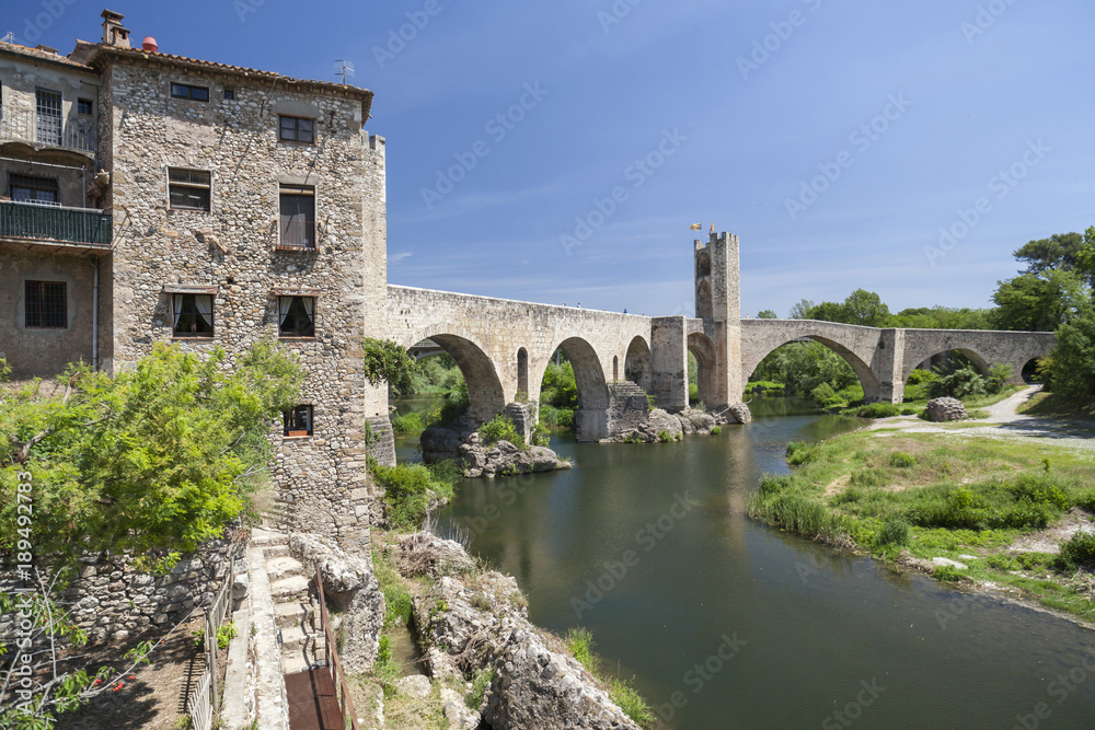 Village view,river and romanesque bridge in medieval village of Besalu,Catalonia,Spain.
