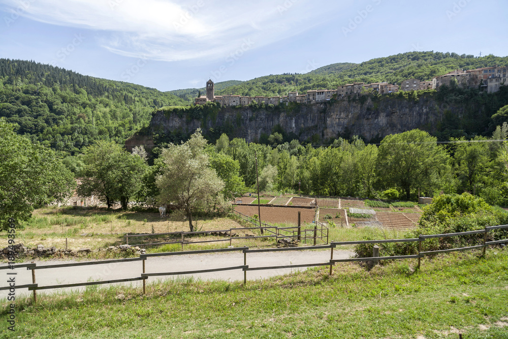 Landscape in Garrotxa region,at background village of Castellfollit de la Roca,Catalonia,Spain. Landscape in Garrotxa region,at background village of Castellfollit de la Roca,Catalonia,Spain.