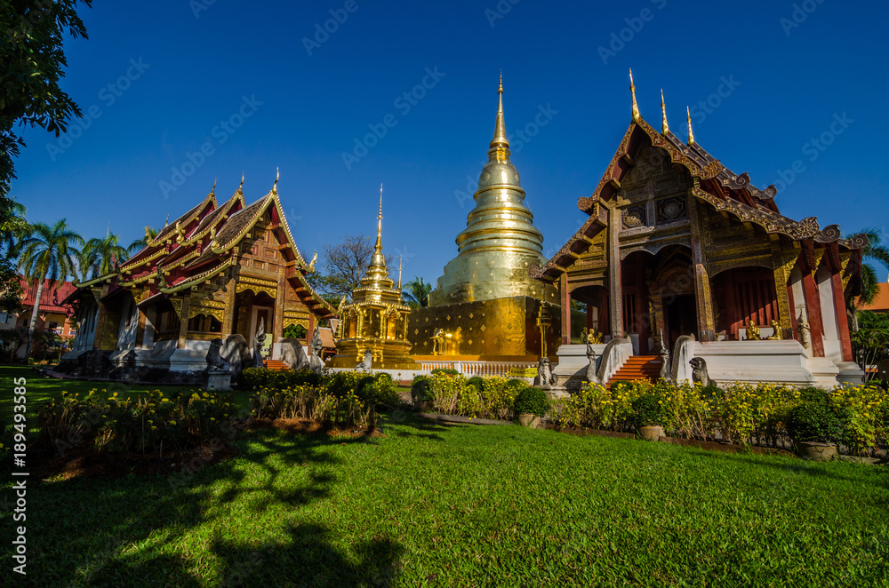 Naklejka premium Old Church and golden pagoda at phra singh temple