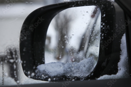 The side mirror where the snow arrived