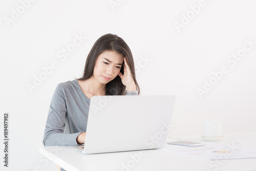 Asian women with stress from work in the office.