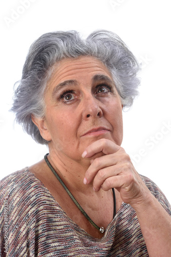 thoughtful senior woman on white background