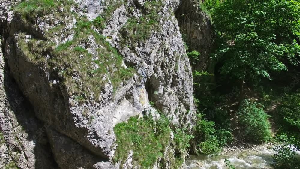 Drone flight over river and mountain cliffs Drone flight over river and mountain cliffs