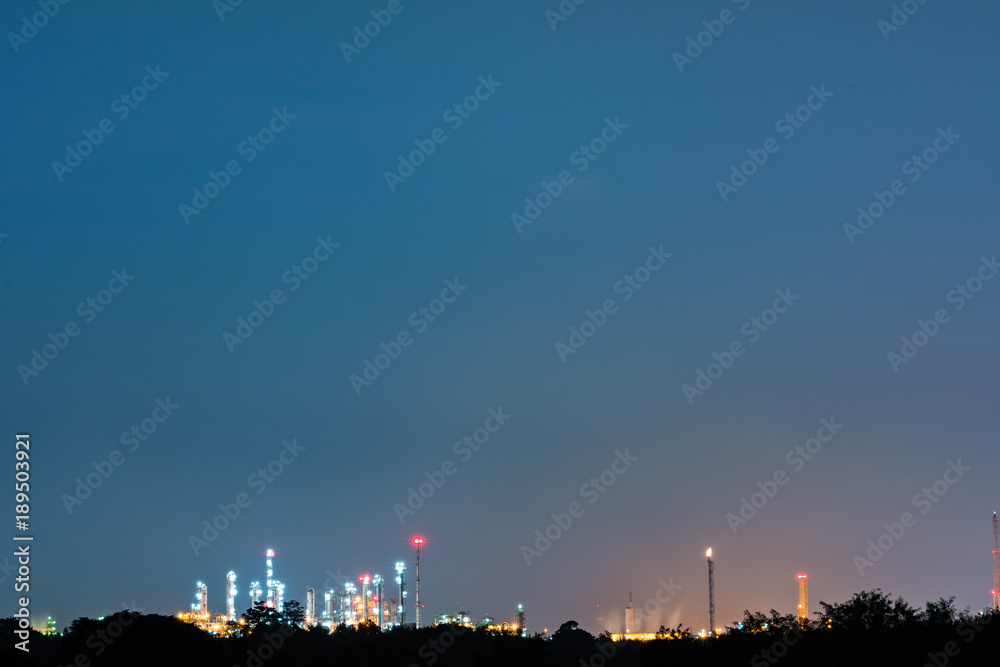 Oil and gas refinery plant area at twilight