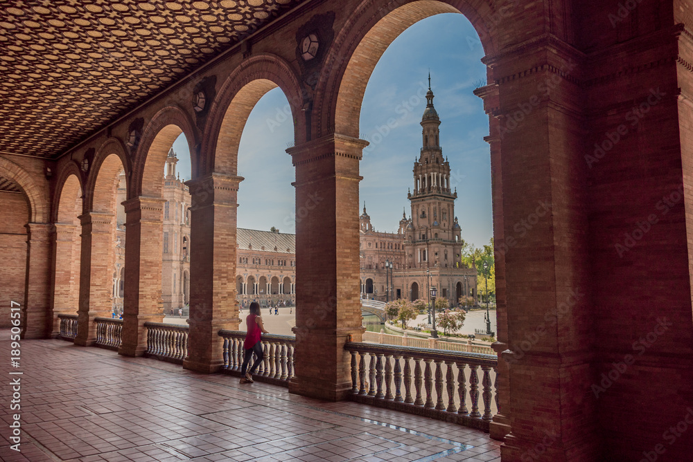 Fototapeta premium Young woman latina tourist visiting Plaza España in Seville