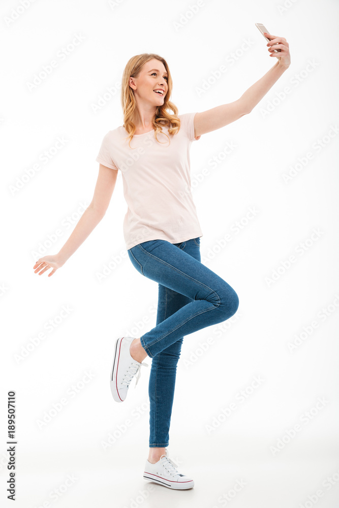 Happy young woman take a selfie by mobile phone. Happy young woman take a selfie by mobile phone.