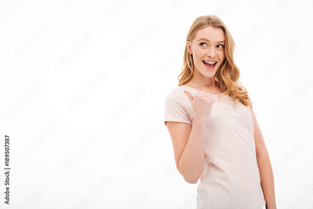Cute young smiling lady pointing. Cute young smiling lady pointing.