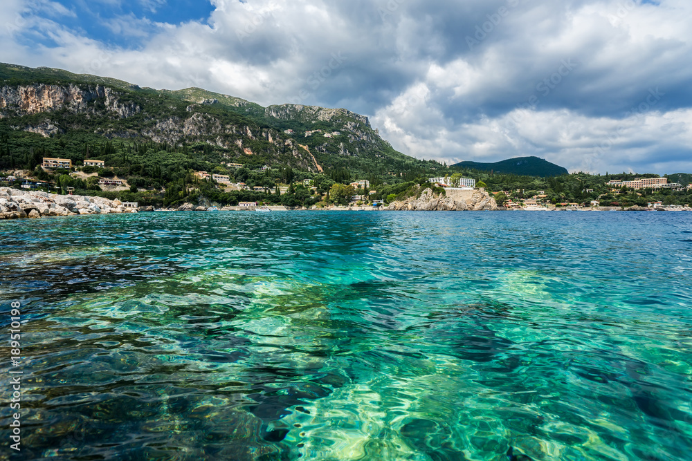 Emerald water of Ionian sea in Paleokastritsa baym Corfu, Greece.