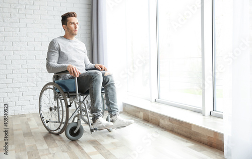 Young man in wheelchair ind...