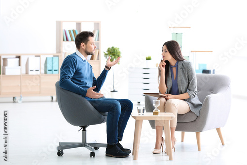 Female psychologist with pa...