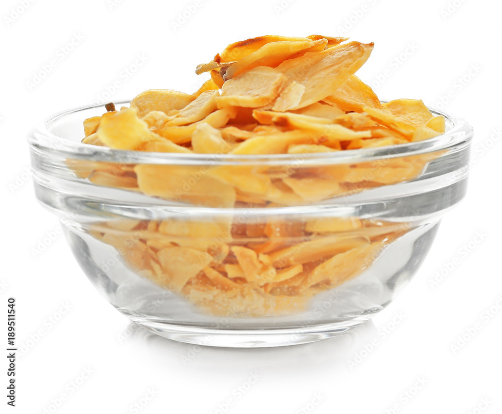 Dried garlic flakes in bowl on white background Dried garlic flakes in bowl on white background