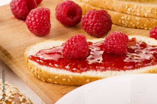 Raspberry jam with fresh raspberry  bread