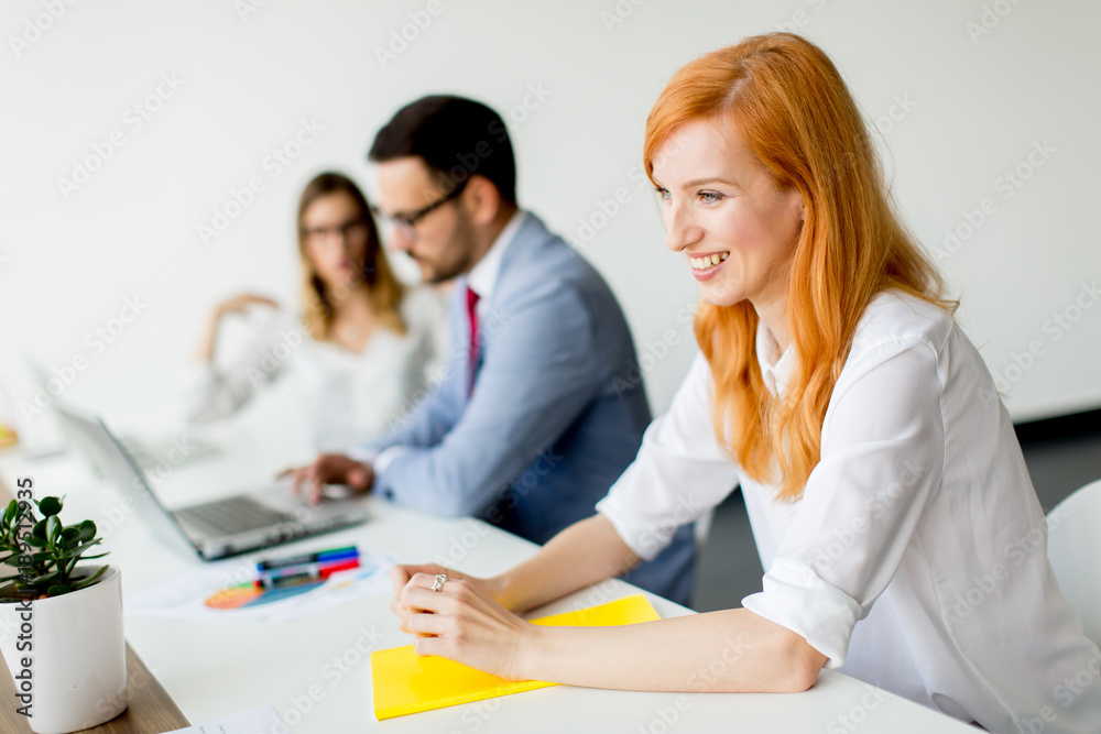 Business people around table during staff meeting Business people around table during staff meeting
