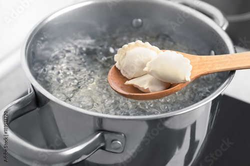 Cooking dumplings in boiling water, closeup