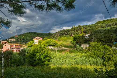 Traditional greek village in mountain at storm cloudy weather. Corfu  Greece.