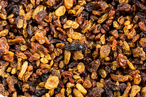 Close-up of golden and brown raisins.