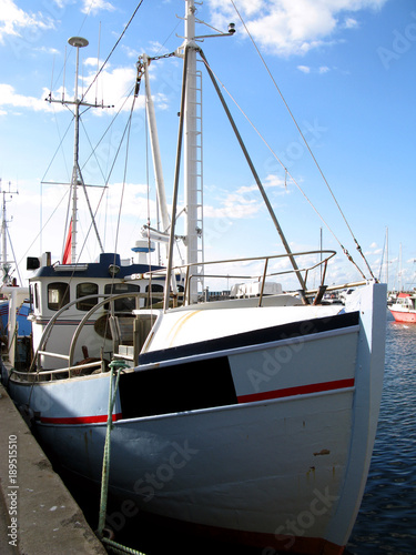 Laesoe / Denmark: Traditional fishing cutter moored in the small fishing port of Vesteroe Havn photo